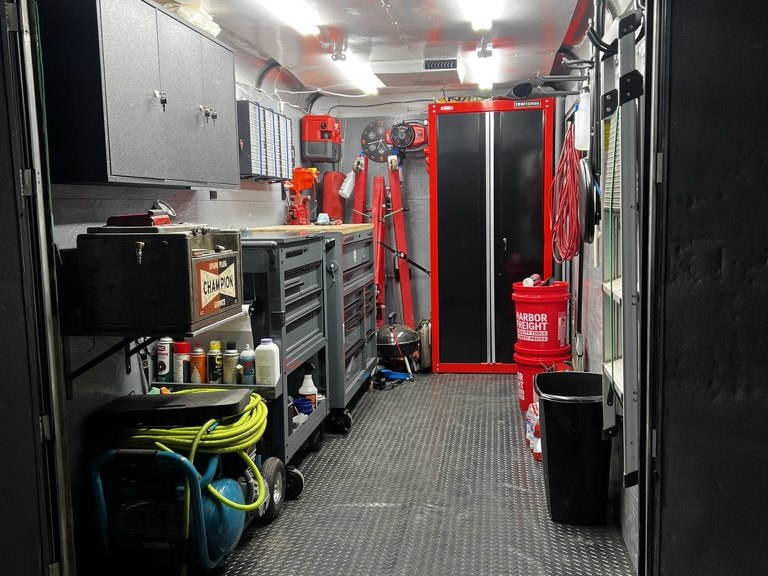 Inside the mobile shop trailer &mdash; tool chests, compressor and parts storage